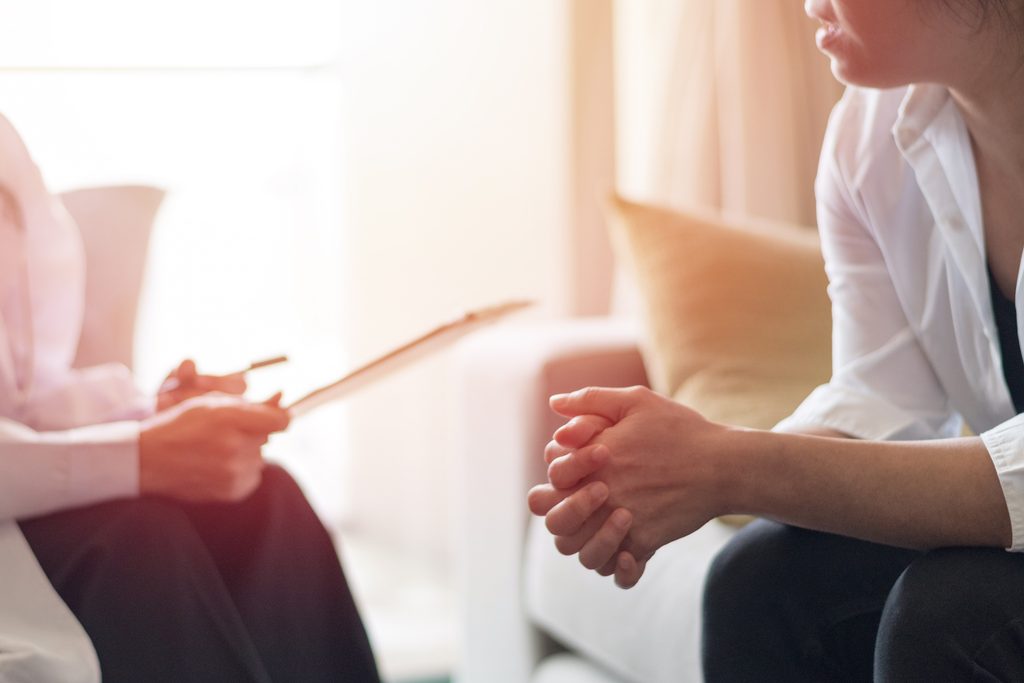 Therapist speaking with a client during an anxiety counseling session