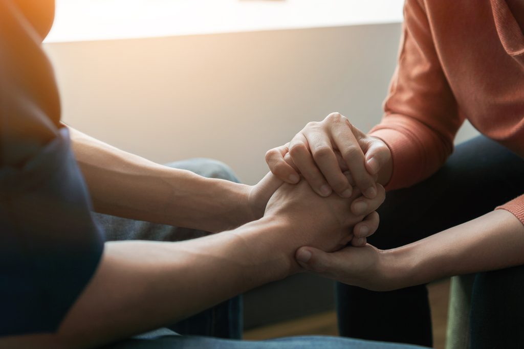 Therapist providing support during a cognitive behavioral therapy session