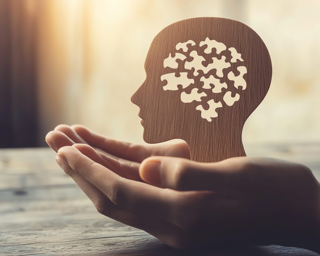 Mental health support represented by a head with puzzle pieces